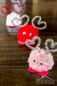 how-to-make-valentines-day-pom-pom-monsters-practically-functional